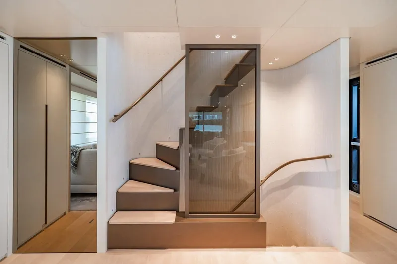 Legacy Yacht Photos Pics Elegant interior staircase on 2022 Sanlorenzo SD96 yacht, featuring modern design and sleek finishes.