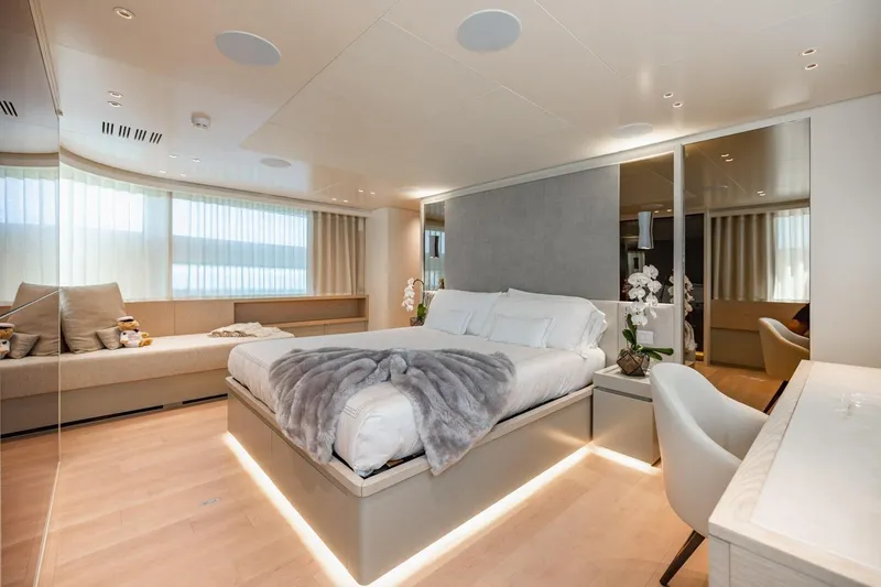 Legacy Yacht Photos Pics Luxurious bedroom interior of 2022 Sanlorenzo SD96 yacht with modern decor and ambient lighting.