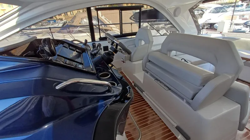  Yacht Photos Pics 2023 Beneteau Gran Turismo 41 cockpit with modern controls and comfortable seating.