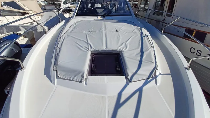  Yacht Photos Pics 2023 Beneteau Gran Turismo 41 yacht deck with sunpad and hatch.