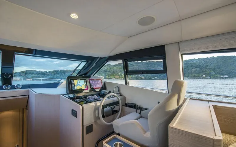  Yacht Photos Pics Interior of 2025 Ferretti Yachts 500, featuring modern helm and panoramic windows.