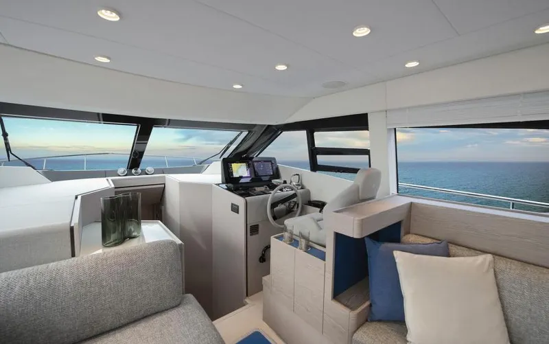  Yacht Photos Pics Luxurious interior of 2025 Ferretti Yachts 500 with ocean view and modern helm.