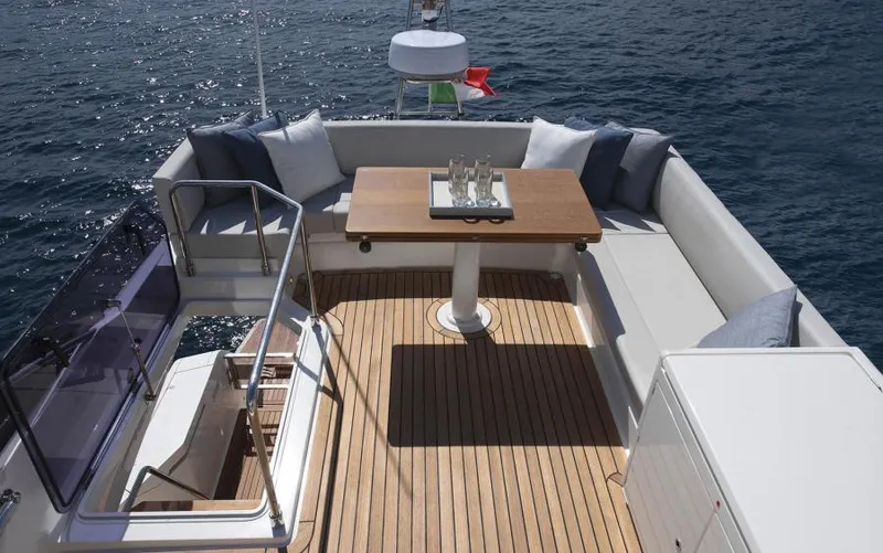  Yacht Photos Pics Luxurious deck of 2025 Ferretti Yachts 500 with elegant seating and ocean view.
