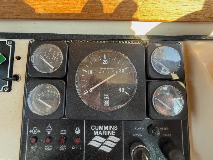 Emerald Isle Yacht Photos Pics 1998 Nordic Tug Trawler dashboard with Cummins Marine engine gauges and controls.