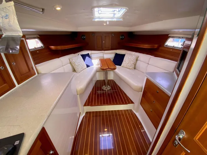 Glory Yacht Photos Pics Luxurious interior of 2006 MJM 34z Express HT yacht with elegant wood finishes.