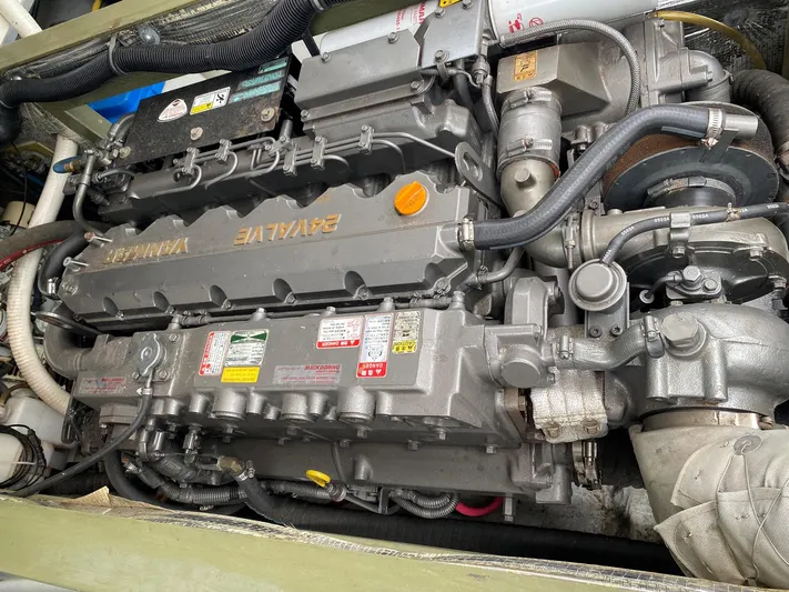 Glory Yacht Photos Pics Engine of a 2006 MJM 34z Express HT boat, showcasing detailed mechanical components.