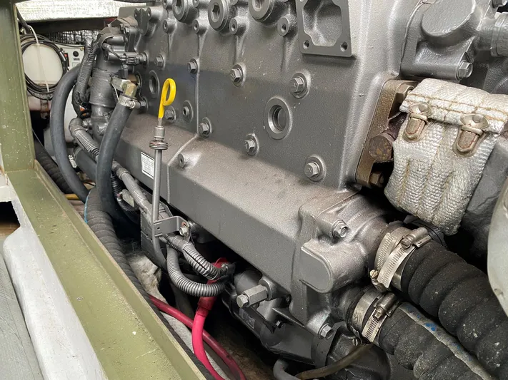 Glory Yacht Photos Pics Engine compartment of a 2006 MJM 34z Express HT boat, showing detailed mechanical components.