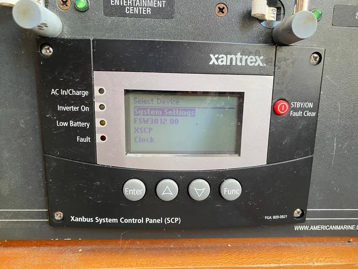 Glory Yacht Photos Pics Xantrex control panel on 2006 MJM 34z Express HT, displaying system settings.