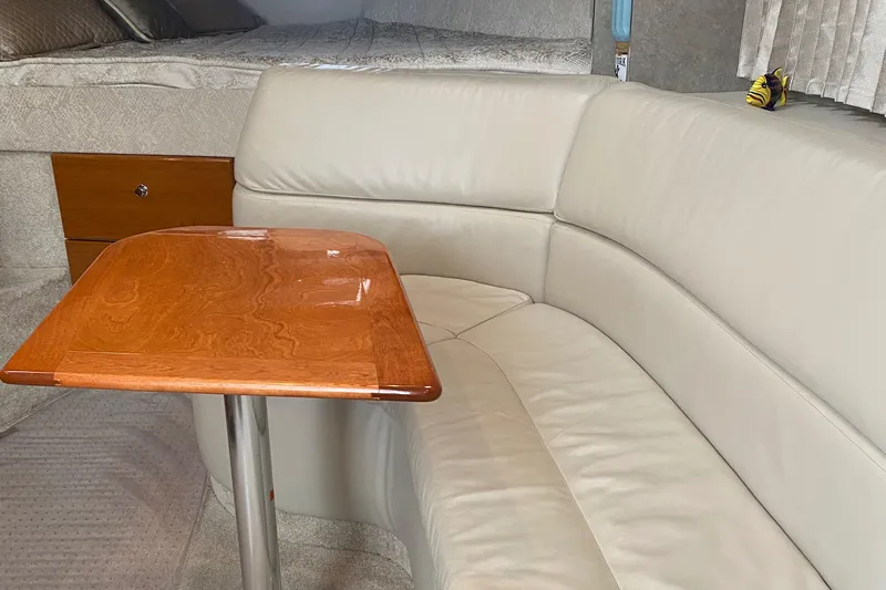  Yacht Photos Pics Luxurious interior of a 2012 Formula 31PC with leather seating and wooden table.