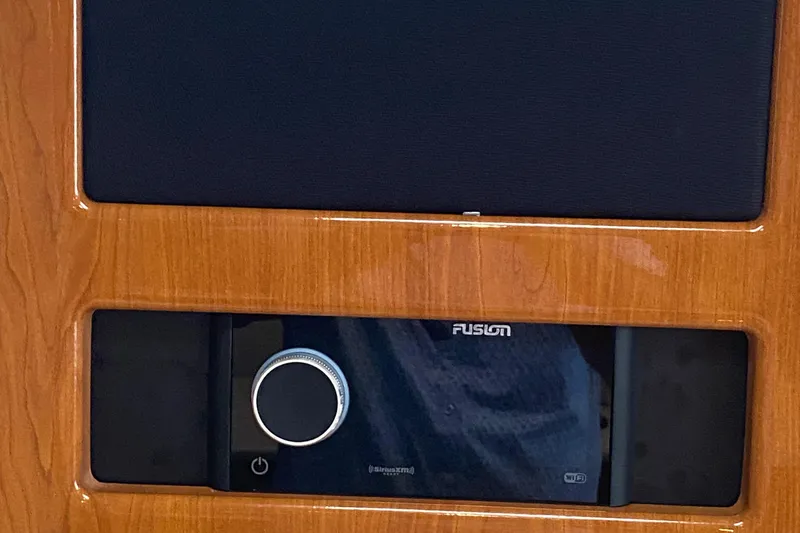  Yacht Photos Pics Fusion audio system in 2012 Formula 31PC boat, featuring sleek wood paneling.