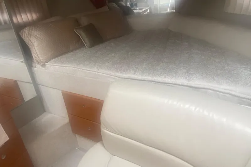  Yacht Photos Pics Interior of 2012 Formula 31PC boat with bed and seating area.
