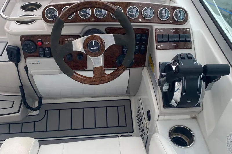  Yacht Photos Pics Steering console of a 2012 Formula 31PC boat with gauges and controls.