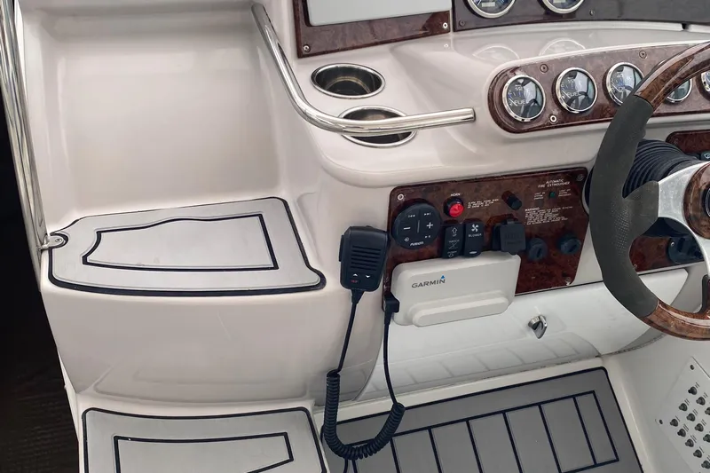  Yacht Photos Pics 2012 Formula 31PC boat dashboard with steering wheel, gauges, and Garmin device.