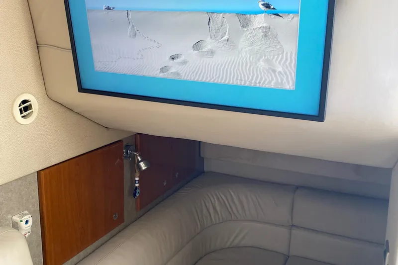  Yacht Photos Pics Interior of 2012 Formula 31PC boat with framed beach photo and leather seating.