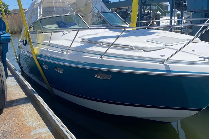  Yacht Photos Pics 2012 Formula 31PC boat docked, featuring sleek design and blue hull.