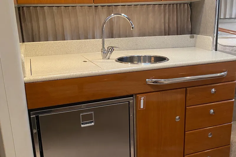  Yacht Photos Pics 2012 Formula 31PC yacht kitchenette with sink, countertop, and storage drawers.