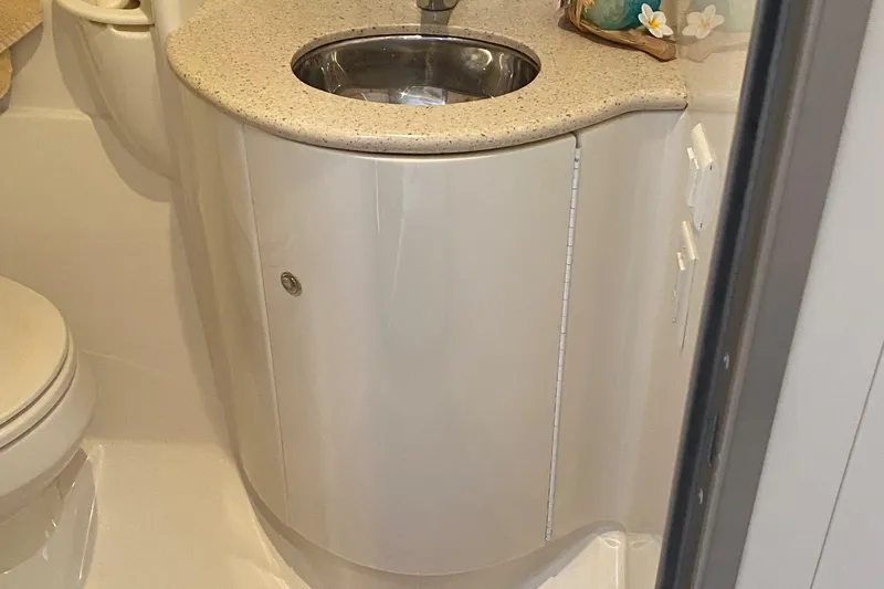  Yacht Photos Pics Compact bathroom sink in a 2012 Formula 31PC boat, featuring a sleek countertop design.