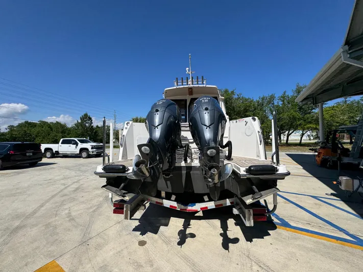  Yacht Photos Pics 2024 Cutwater C-288 Coupe boat with dual outboard motors on a trailer.