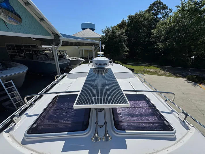  Yacht Photos Pics 2024 Cutwater C-288 Coupe boat with solar panel and Garmin equipment on deck.