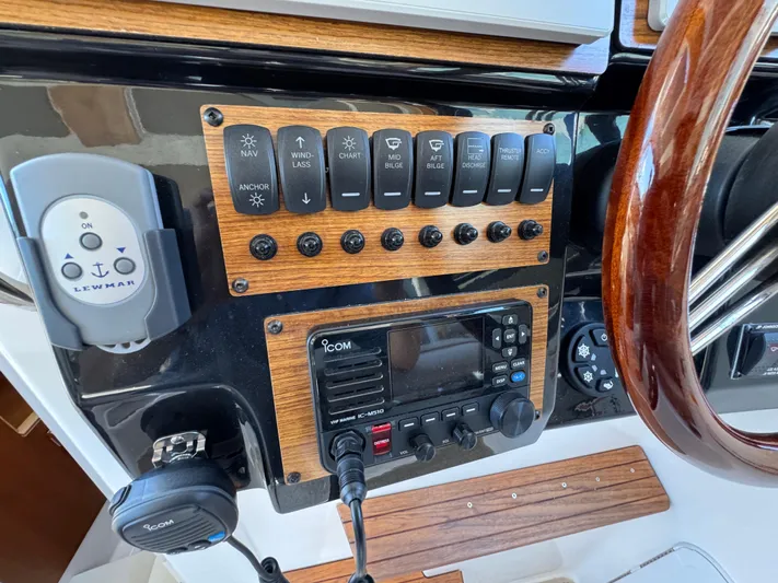  Yacht Photos Pics 2024 Cutwater C-288 Coupe dashboard with control panel and steering wheel.