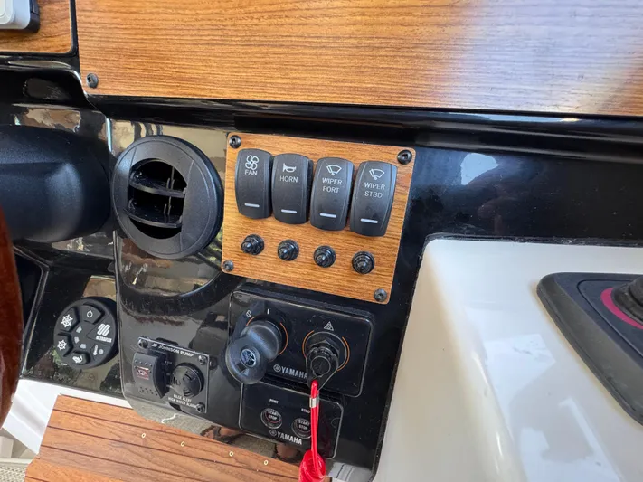 Yacht Photos Pics 2024 Cutwater C-288 Coupe dashboard with control panel and switches.