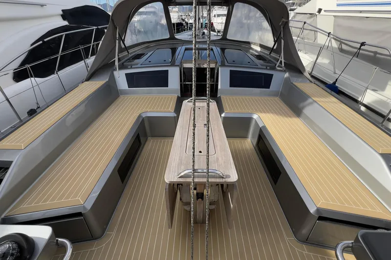  Yacht Photos Pics Spacious cockpit of 2017 Grand Soleil 52 LC yacht with sleek seating and table.