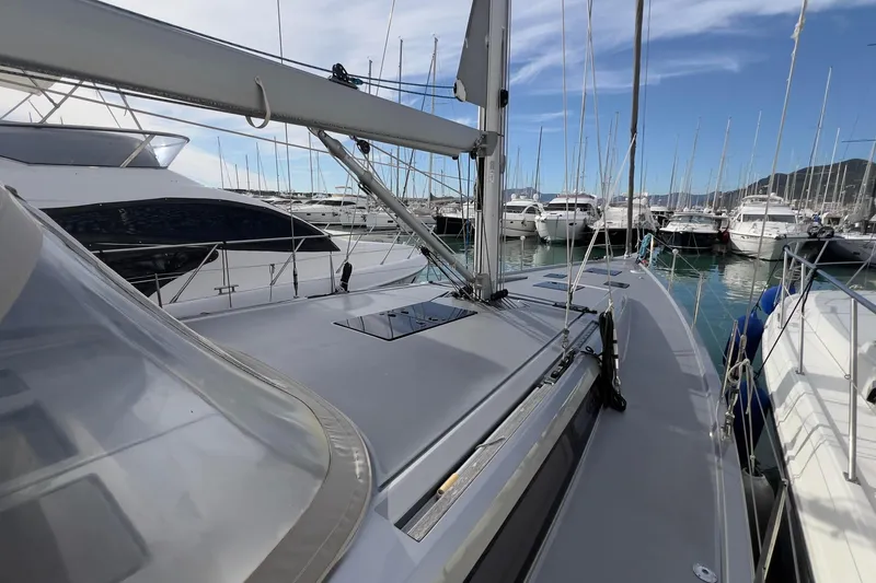  Yacht Photos Pics 2017 Grand Soleil 52 LC yacht docked in a marina, surrounded by other boats.