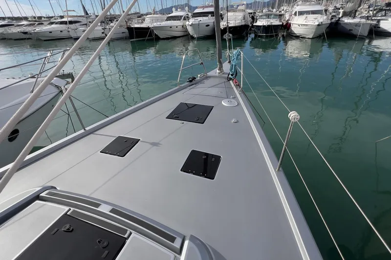  Yacht Photos Pics Grand Soleil 52 LC 2017 yacht deck in marina, surrounded by boats.