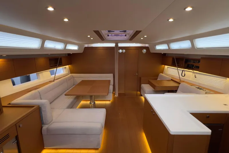  Yacht Photos Pics Luxurious interior of 2017 Grand Soleil 52 LC yacht with modern seating and lighting.