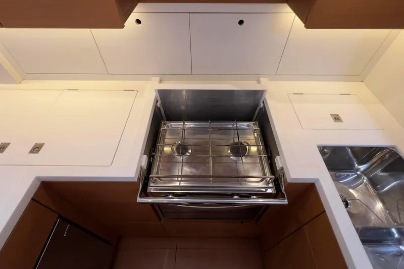  Yacht Photos Pics Modern kitchen area in 2017 Grand Soleil 52 LC yacht with stove and sink.