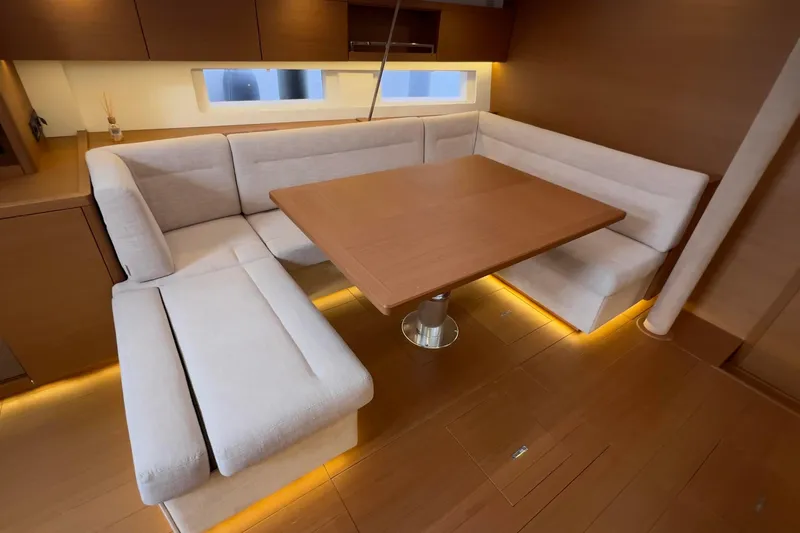  Yacht Photos Pics Luxurious interior of 2017 Grand Soleil 52 LC yacht with elegant dining area.