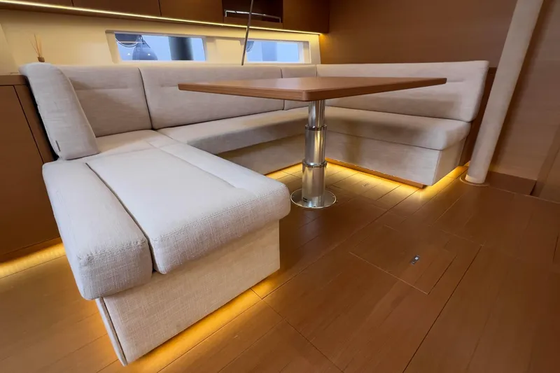  Yacht Photos Pics Luxurious interior of 2017 Grand Soleil 52 LC yacht with elegant seating and ambient lighting.