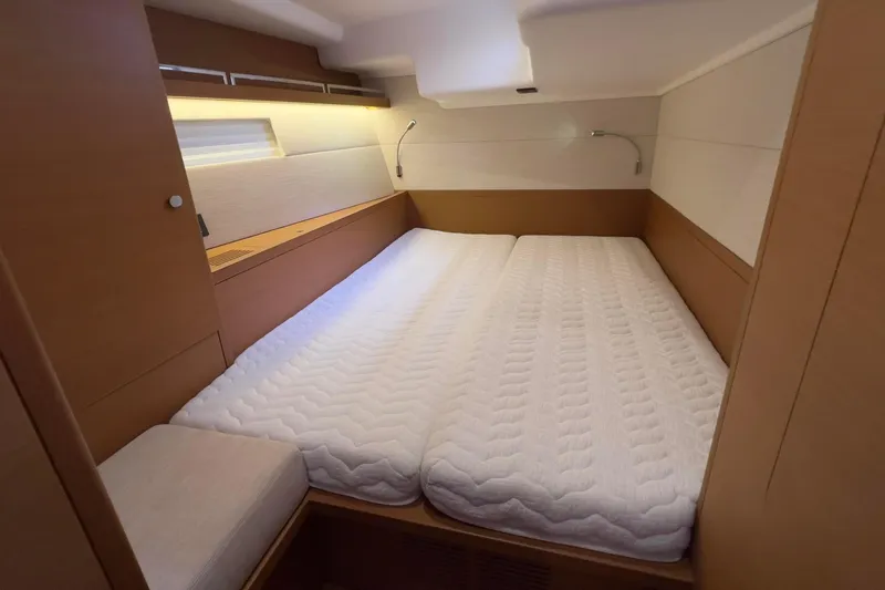  Yacht Photos Pics Luxurious cabin interior of 2017 Grand Soleil 52 LC yacht with cozy bedding.