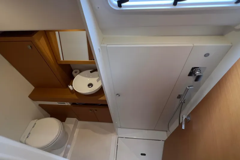  Yacht Photos Pics Bathroom interior of 2017 Grand Soleil 52 LC yacht, featuring modern fixtures and wood accents.