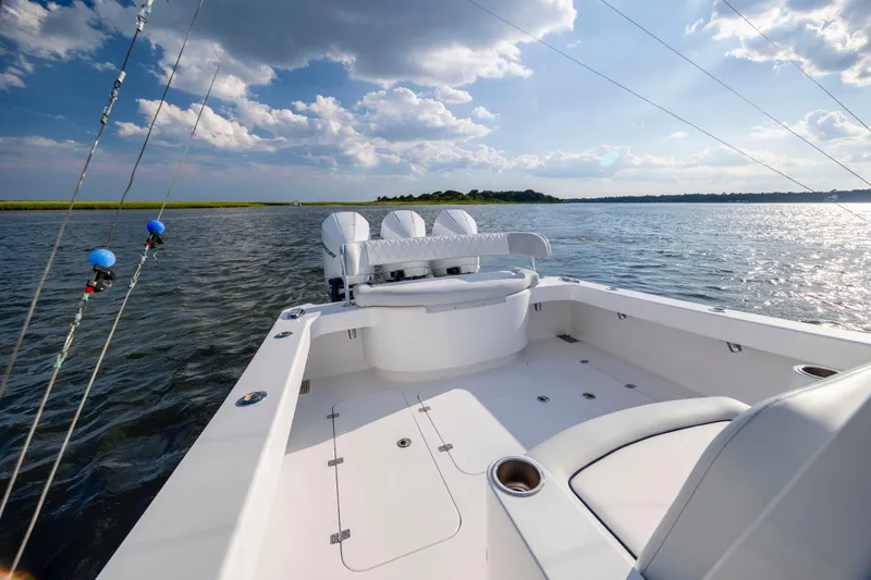  Yacht Photos Pics 2018 Tribute 37 boat on calm water under a partly cloudy sky.