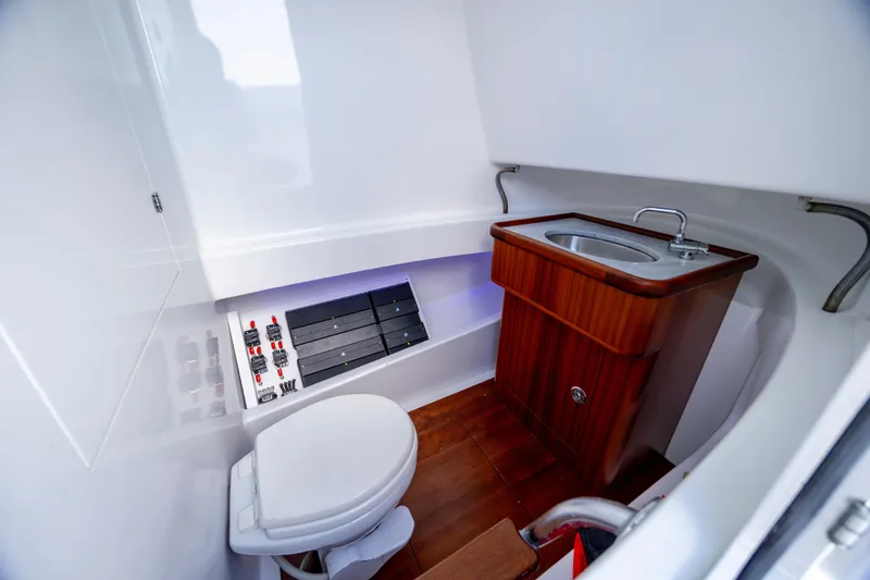  Yacht Photos Pics Luxurious 2018 Tribute 37 boat bathroom with wooden sink and modern fixtures.