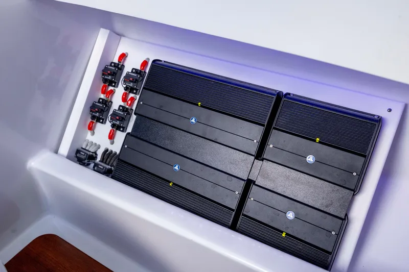  Yacht Photos Pics Electrical system in 2018 Tribute 37 boat, featuring multiple circuit breakers and amplifiers.