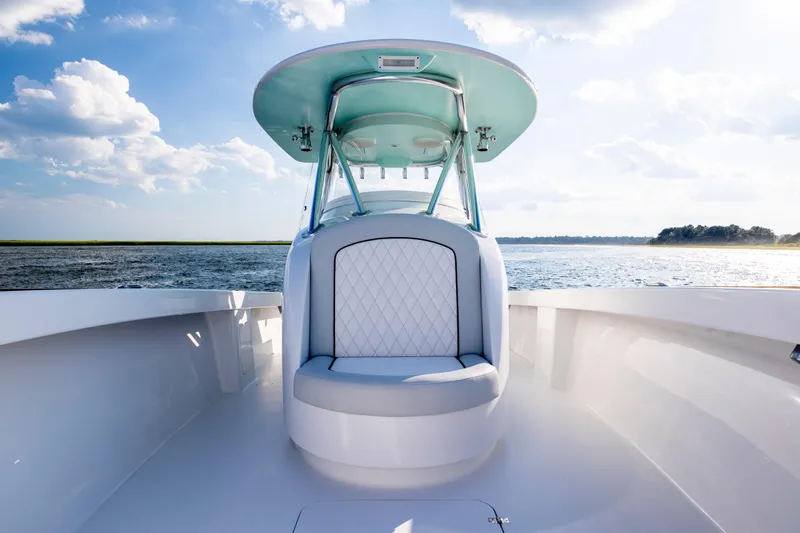  Yacht Photos Pics 2018 Tribute 37 boat interior with cushioned seating, ocean view, and clear sky.