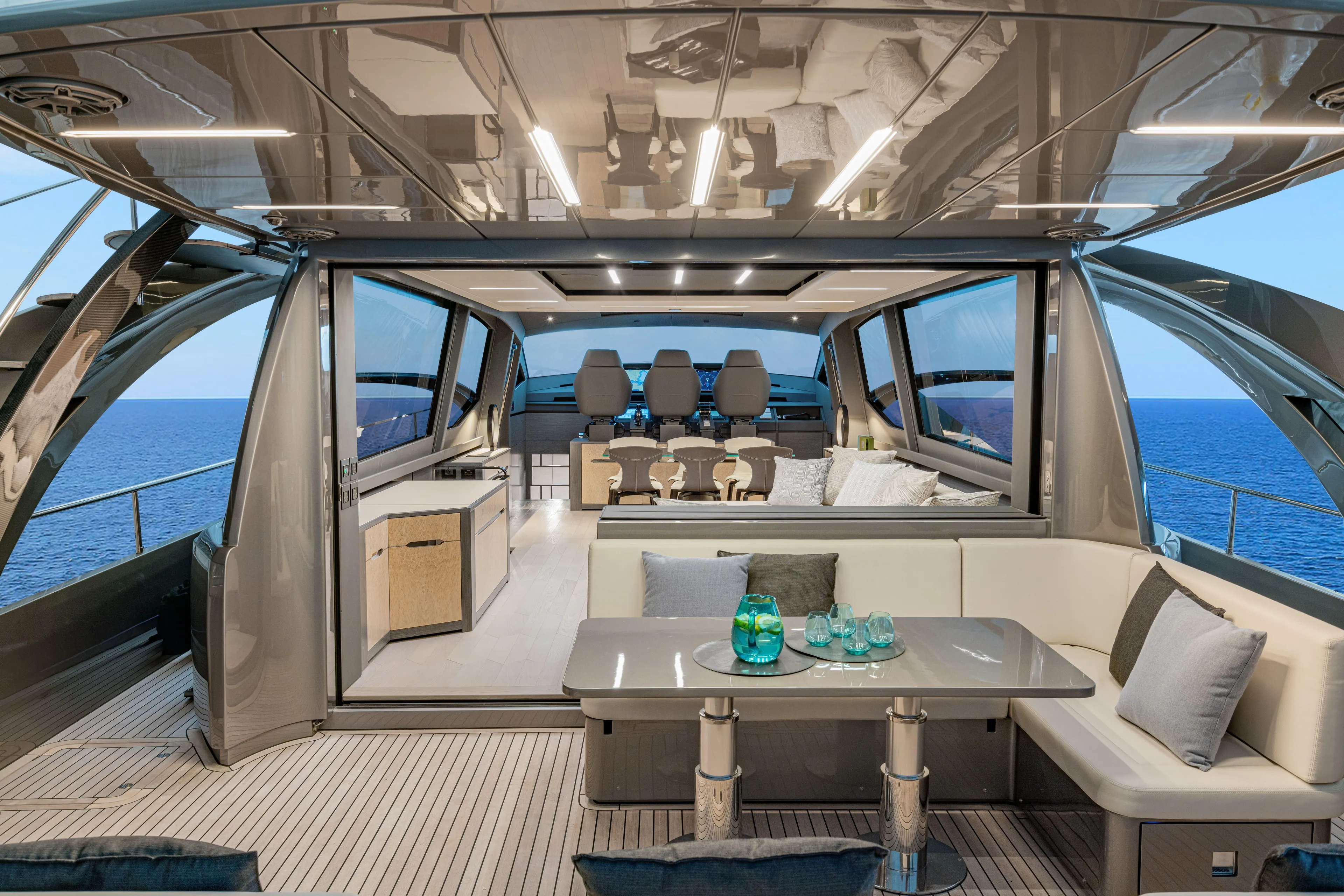 Silver Bullet Yacht Photos Pics Luxurious interior of 2022 Pershing 8X yacht with ocean view and modern seating area.