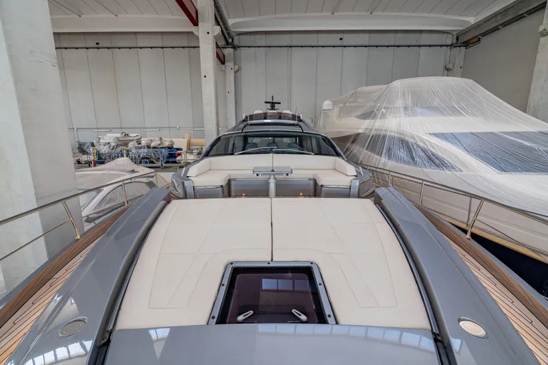 Silver Bullet Yacht Photos Pics 2022 Pershing 8X yacht in a storage facility, showcasing sleek design and luxury features.