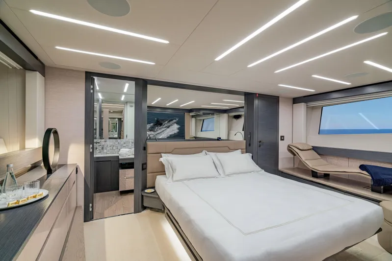 Silver Bullet Yacht Photos Pics Luxurious bedroom interior of 2022 Pershing 8X yacht with modern design and ocean view.