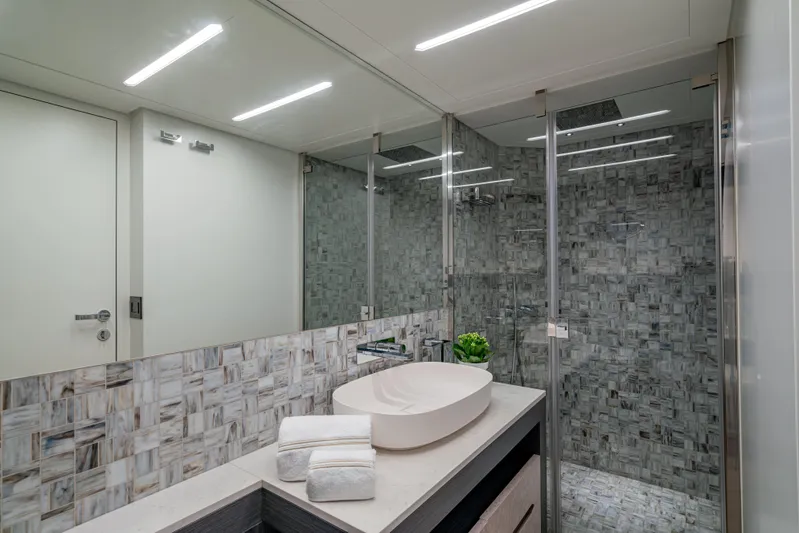 Silver Bullet Yacht Photos Pics Luxurious bathroom in 2022 Pershing 8X yacht with modern fixtures and elegant design.
