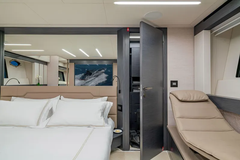 Silver Bullet Yacht Photos Pics Luxurious bedroom interior of 2022 Pershing 8X yacht with modern design and elegant furnishings.