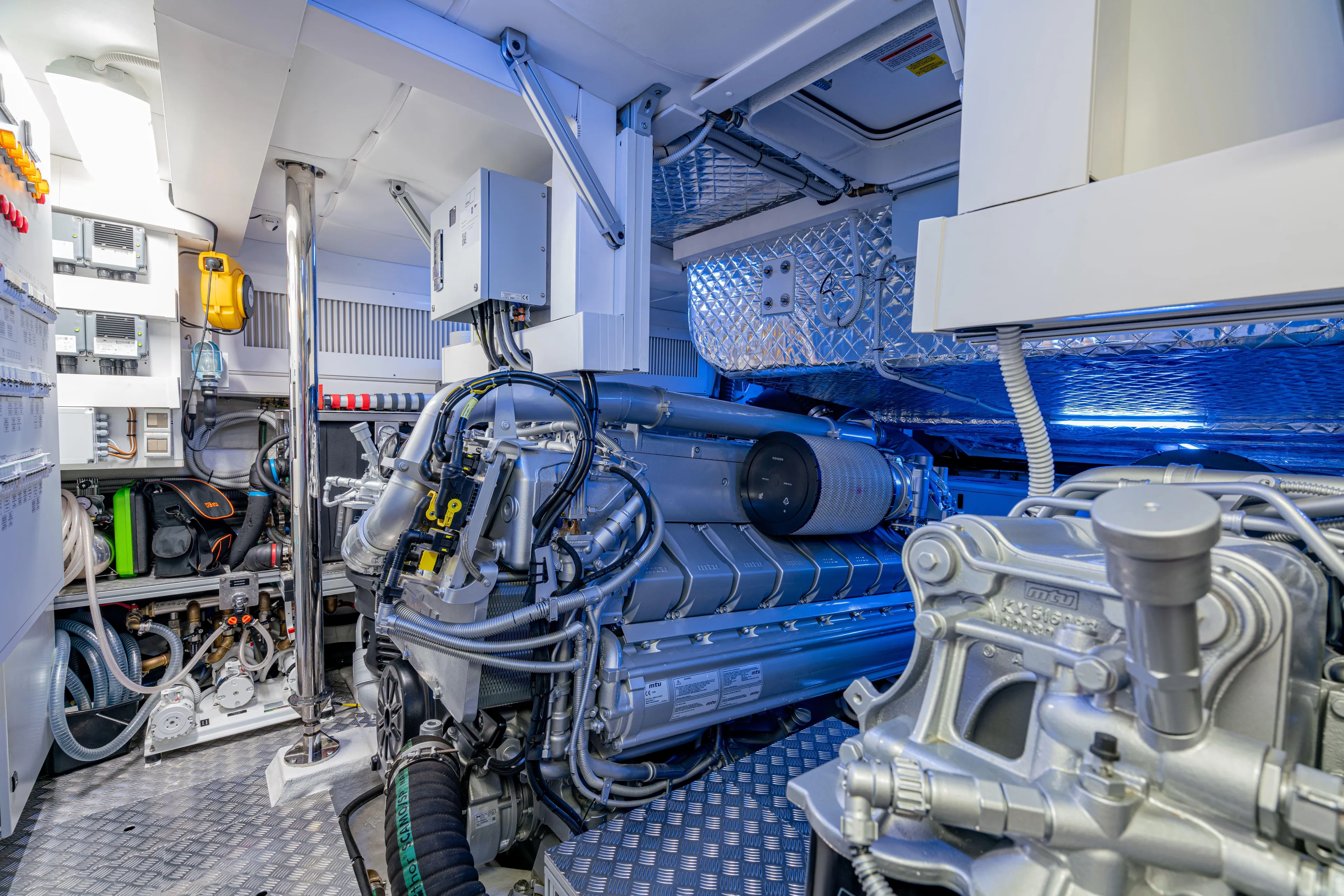 Silver Bullet Yacht Photos Pics Engine room of a 2022 Pershing 8X yacht, showcasing advanced machinery and equipment.