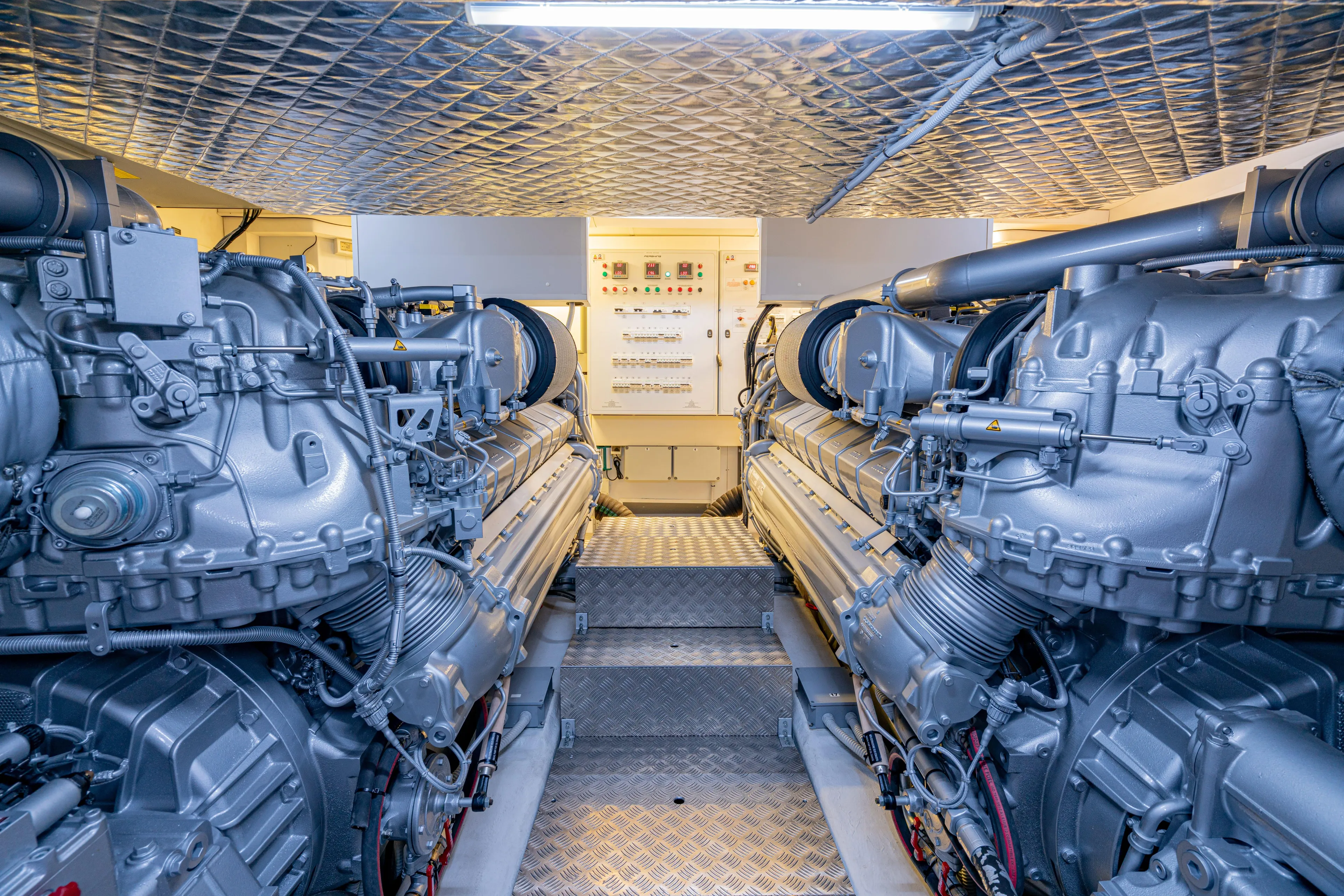 Silver Bullet Yacht Photos Pics Engine room of 2022 Pershing 8X yacht, featuring advanced machinery and control panels.