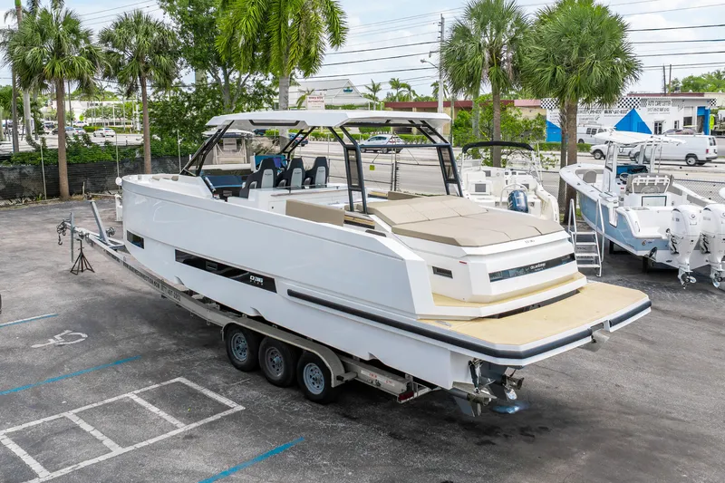  Yacht Photos Pics 2025 De Antonio Yachts D36 OPEN on trailer, parked outdoors with palm trees.