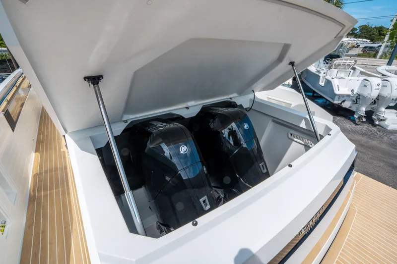  Yacht Photos Pics 2025 De Antonio Yachts D36 OPEN with dual outboard engines under open hatch.