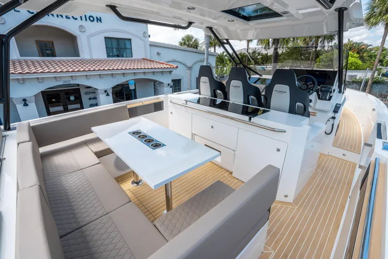  Yacht Photos Pics 2025 De Antonio Yachts D36 OPEN interior with seating and helm, showcasing modern design.
