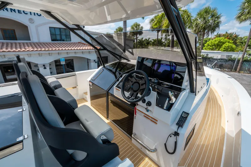  Yacht Photos Pics 2025 De Antonio Yachts D36 OPEN helm with modern controls and seating.