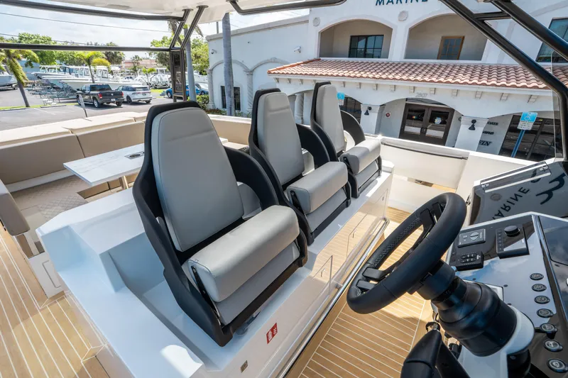  Yacht Photos Pics 2025 De Antonio Yachts D36 OPEN cockpit with modern seating and steering wheel.